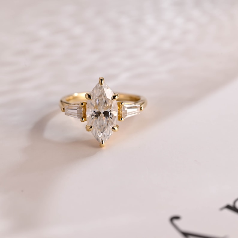 Stunning 1.0 - 2.0 CT Marquise Moissanite Engagement Ring with Three Stone and Hidden Halo Design 1